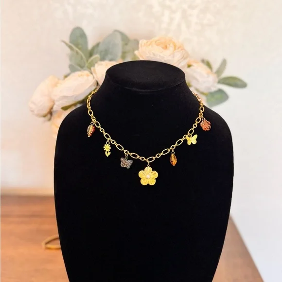 Charming Gold Necklace with Floral and Butterfly Accents - Picture 3 of 5
